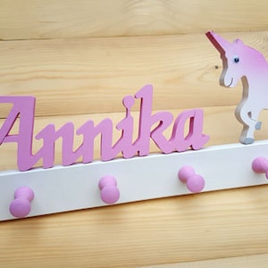 Children&#39;s wardrobe made of wood with unicorn