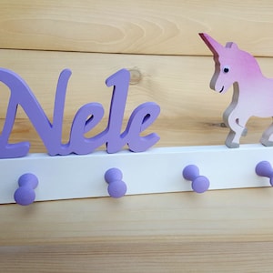 Children&#39;s wooden coat rack with unicorn