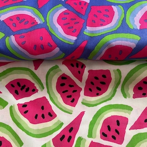 May include: Two fabrics featuring a watermelon slice design. One has a blue background with pink, green, and white watermelon slices. The other has a white background with pink and green watermelon slices.