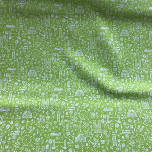May include: Green fabric with a white repeating pattern of London landmarks, including Big Ben, the London Eye, double-decker buses, and red telephone booths.