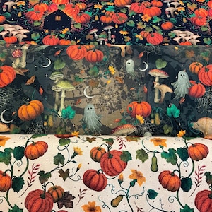 May include: Three rolls of fabric featuring distinct patterns. The top roll has orange pumpkins, mushrooms, and black houses on a dark background. The middle roll displays ghosts, pumpkins, and mushrooms on a dark forest scene. The bottom roll shows orange pumpkins and green leaves on a cream background.