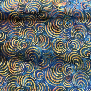 100% Cotton hand painted batik fabric by Nutex. Batik material, swirl. Abstract Suitable for patchwork, quilting, dressmaking etc. Blue with yellow