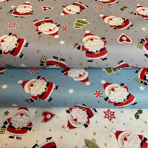 May include: Three different fabric swatches with a repeating pattern of Santa Claus figures. The top swatch is gray with gold stars and a white background. The middle swatch is light blue with white stars and a white background. The bottom swatch is white with gold stars and a white background.