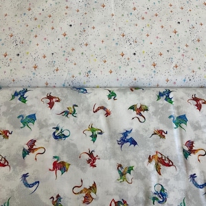 May include: Two fabric swatches. The top swatch is white with a pattern of colorful stars. The bottom swatch is white with a gray cloud-like pattern and a repeating pattern of colorful dragons.