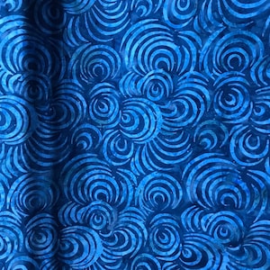 100% Cotton hand painted batik fabric by Nutex. Batik material, swirl. Abstract Suitable for patchwork, quilting, dressmaking etc. Light Blue