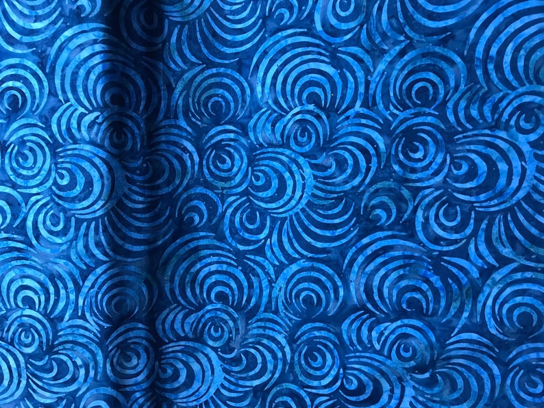 100% Cotton hand painted batik fabric by Nutex. Batik material, swirl. Abstract Suitable for patchwork, quilting, dressmaking etc. Light Blue