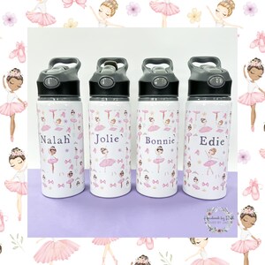 May include: Four personalised stainless steel water bottles with a white background and a pink ballerina pattern. The bottles have black lids and are labelled with the names Nalah, Jolie, Bonnie, and Edie.