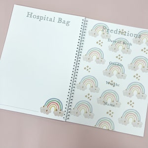 May include: A white spiral bound book with a rainbow and star pattern on the cover. The book has the title "Predictions" and includes sections for "Date of Birth", "Gender", "Weight", and "Name".