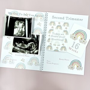May include: A pregnancy journal with a rainbow and star pattern. The page shows an ultrasound photo and a card that says "Today we Heard your Heartbeat 16 Weeks".