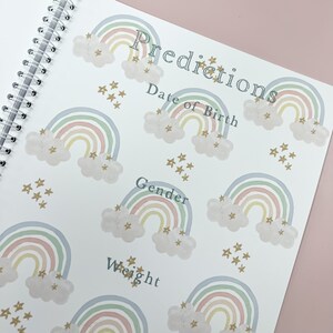 May include: A white page with the word "Predictions" at the top, followed by "Date of Birth", "Gender", and "Weight". The page is decorated with pastel rainbow illustrations and gold stars.