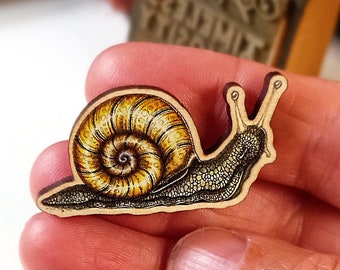 Snail brooch wooden badge unique designed British wildlife lapel accessory Timeless Curiosity Zentangle inspired gastropod mini artwork pin