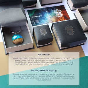 May include: A necklace with a teal and brown resin pendant. The pendant is in a small white box. The text "Gift note: We would love to hand write your short note on a little card that goes inside the box. Leave your note at checkout and don't forget to say who it is from! Receipts are not included in the packaging, so you don't need to worry about it when gifting! For Express Shipping: Pease also let us know a phone number for delivery. The phone number will make delivery easier, safer and faster. Let us know by leaving a note at checkout or send us a direct message after your purchase." is on a white background.