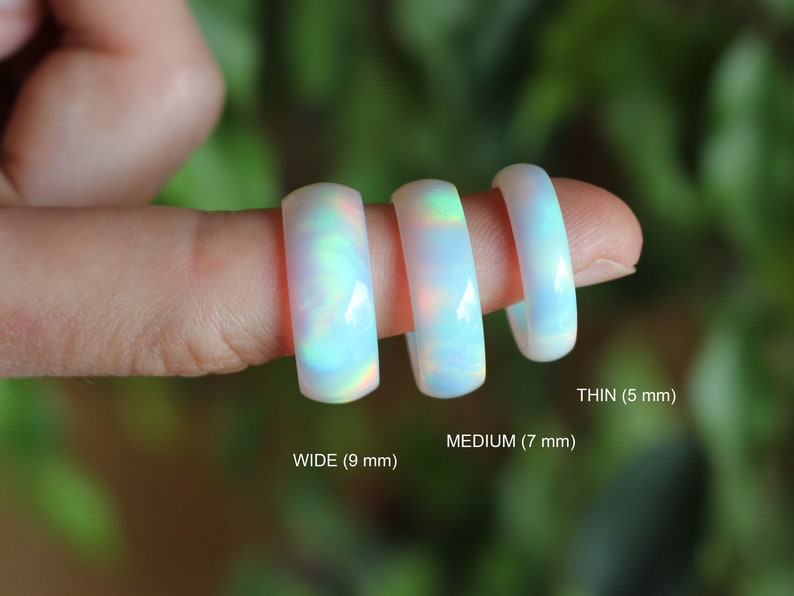 Three width options of handcrafted ring made of lab grown opal that changes colors with movement. Iridescent glow adds a unique touch. Lightweight and comfortable to wear.