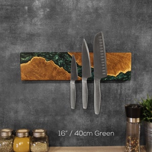 Wall hanging magnetic knife holder made of pieces of burl wood, in combination with green resin. Perfect gift for chefs & cooking enthusiasts.