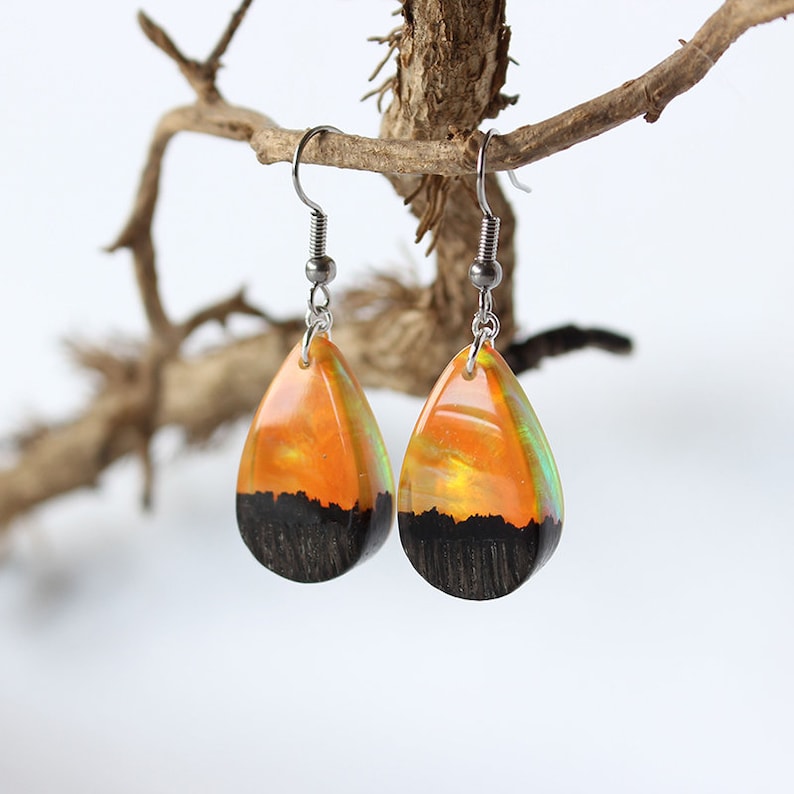 Teardrop earrings handmade with yellow lab-created opal, wood and resin. Opals iridescent colors shift from green, yellow & orange, and the wood texture gives the impression of a mountain peaks.