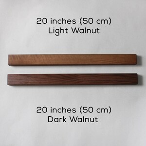 May include: Two wooden magnetic strips, one light walnut and one dark walnut, each measuring 20 inches (50 cm).