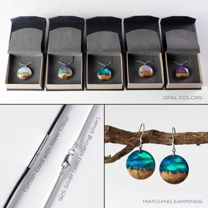 May include: Four wooden pendant necklaces with opal resin inlays in different colors. The necklaces are displayed in black velvet boxes. The image also shows a pair of matching earrings with a blue opal resin inlay. The necklaces are available with a cotton cord with a steel clasp or a 925 silver chain.