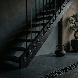 May include: A dark, modern staircase with black metal railings and decorative accents. The wooden steps are painted black, and the scene includes a bonsai tree in a pot and a black teapot, creating a minimalist aesthetic.