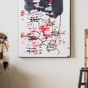 May include: Abstract art painting with black, red, and brown paint strokes on a white background. The painting is signed "Eudora Neil" in the bottom left corner.