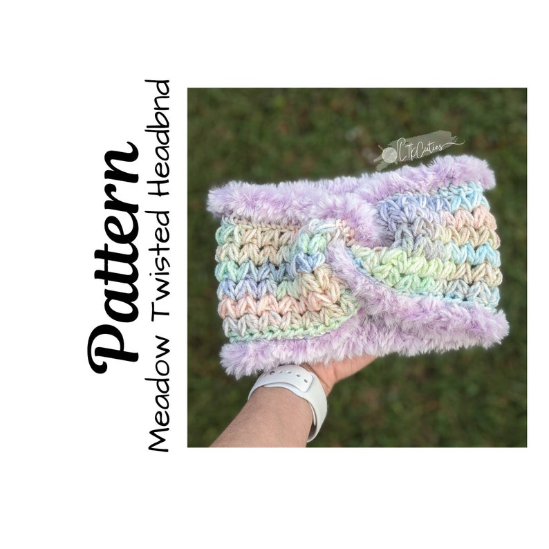 May include: A pastel rainbow colored crochet headband with a purple faux fur trim. The headband is held in a hand.