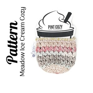May include: A crochet ice cream cozy in pink, beige, and gray with the text "PINT COZY 100% HANDMADE" on a white label.