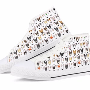 May include: White high-top canvas sneakers with a pattern of colorful bull terrier dog faces.