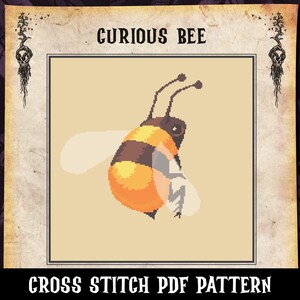 May include: Cross stitch pattern featuring a curious bee with black and yellow stripes, flying with its wings outstretched. The bee is on a beige background with the text "CURIOUS BEE" above it and "CROSS STITCH PDF PATTERN" below it.