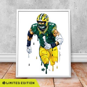 May include: Framed art print of a football player in a green and yellow uniform, with the number 1. The artwork has a unique, dripped paint effect. The words "LIMITED EDITION" are at the bottom.