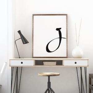 Letter J on white background.
