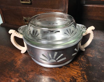 Vintage, retro Pyrex oven dish with aluminium stand