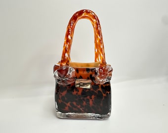 Vincenzo collection Murano glass vase in the form of hand bag. Amber glass with black spots.