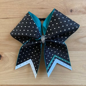 Glitter cheer bow. Custom with your team colors. Price listed is &quot;per bow price&quot;. Comment your colors at checkout. Team Cheer bow, custom