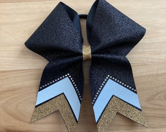 Gorgeous Black, White and Gold Cheer Bow with Rhinestones at the bottom. Price listed is per individual bow. Black cheer bow, black comp bow