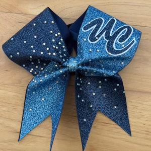 Custom glitter cheer bow with a burst of  rhinestones. Bows made in your teams Colors. Price lIsted is per individual bow. Comp cheer bows