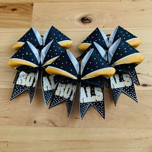 Custom glitter cheer bow covered in rhinestones. Bows made in your teams Colors. Price lIsted is per individual bow.