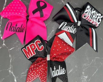 3 custom cheer bows made in your team colors. Rhinestone glitter bow, half-floppy half stiff bow and breast cancer bow. Bow packages