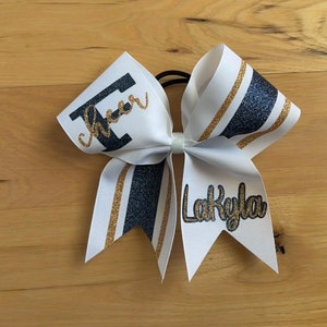 The Lexi Custom Cheer Bow made in your team colors. Price listed is per individual bow. Game day bow, custom cheer bows, sideline cheer bow.