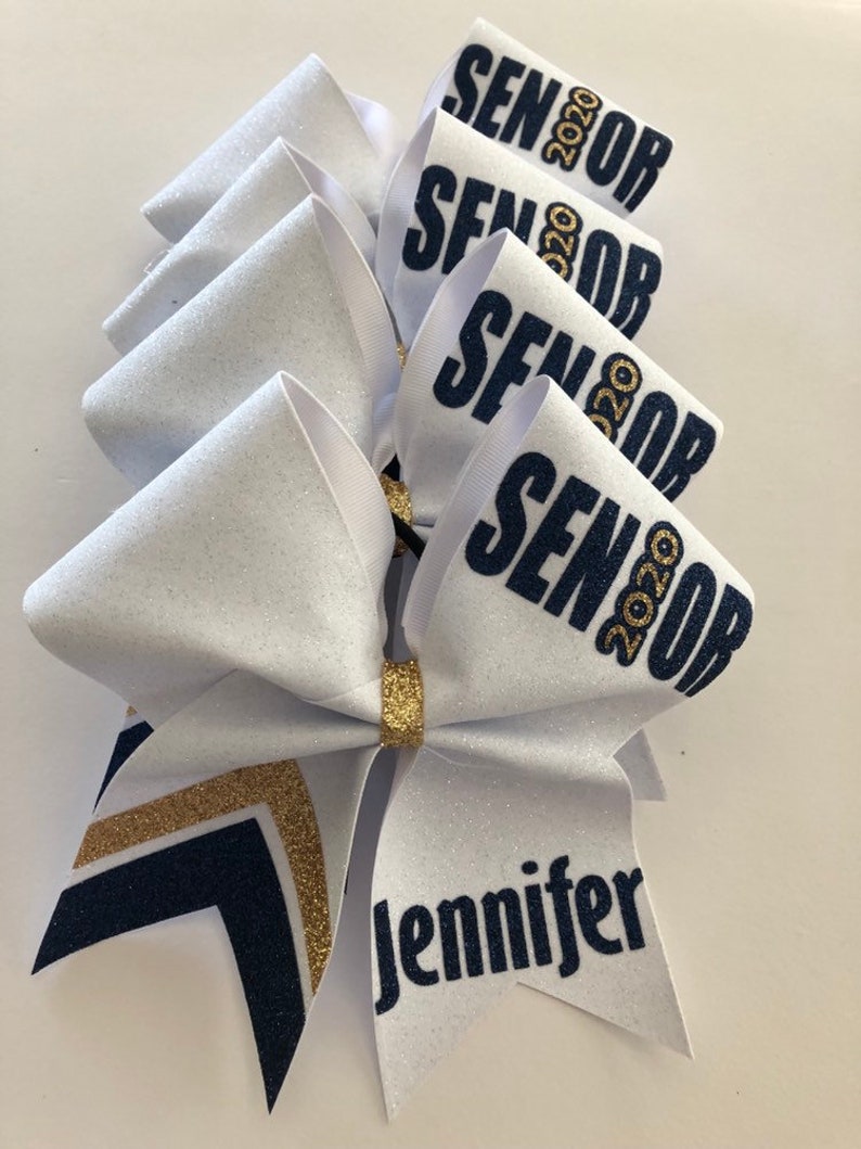 Price listed is per bow price Colors can be made custom to your team colors. White Navy Blue and Gold custom glitter senior cheer bow