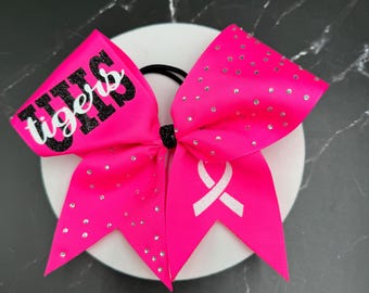 Breast Cancer Cheer Bow with rhinestones on one side. Price listed is "per bow" price. Come team initials at checkout. Pink cheer bows, pink