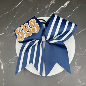 New game day cheer bow made in your team colors.  Price listed is per individual bow. Comment colors at checkout. Cheer bows