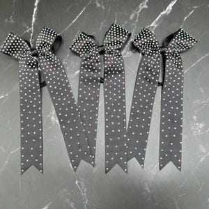 Custom college cheer bows designed in your team colors. Price listed Is per Individual bow, team cheer bow, College bows, ab rhinestones.