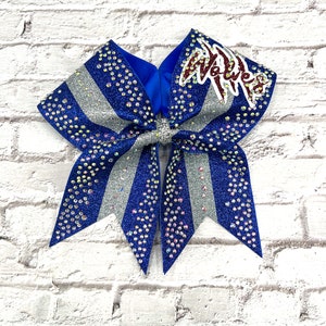 Custom glitter cheer bow covered in rhinestones. Bows made in your teams Colors. Price lIsted is per individual bow.