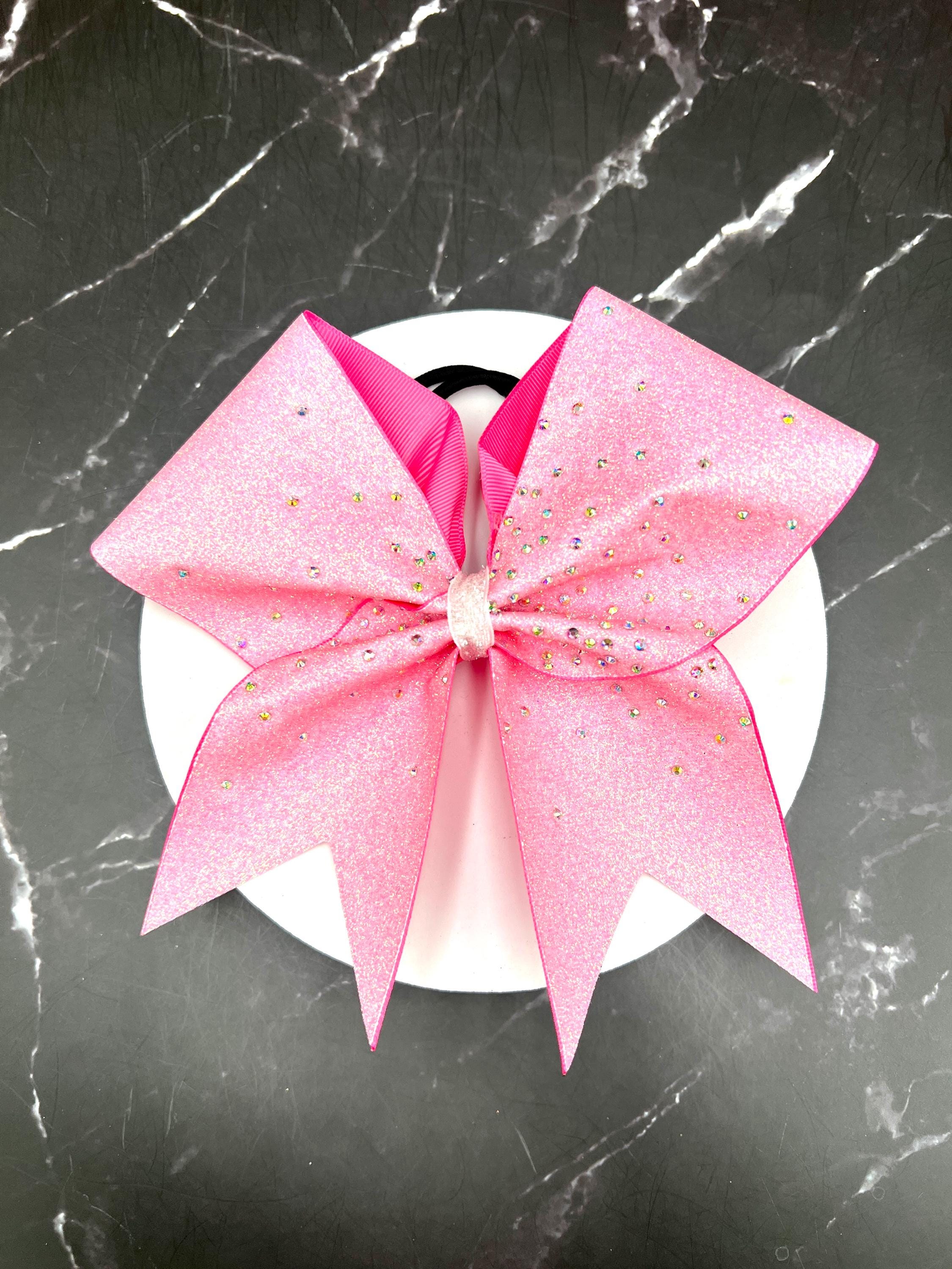 Gorgeous glitter cheer bow with a burst of rhinestones. Price listed is per individual bow. Comment colors at checkout. Pink bow, pink cheer