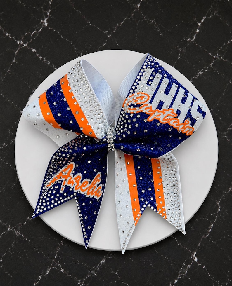 The Gaucho Custom glitter cheer bow covered in rhinestones. Bows made in your teams Colors. Price lIsted is per individual bow. Comp bow afbeelding 1
