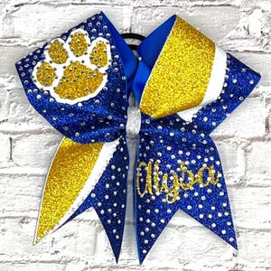 The Piper Cheer Bows designed in your team colors. Price listed Is per Individual cheer Bow, cheer bow, team cheer bow, glitter cheer bow