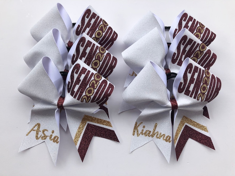 Price listed is per bow price Colors can be made custom to your team colors. White Navy Blue and Gold custom glitter senior cheer bow
