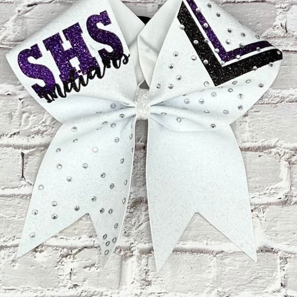 All glitter cheer bow made in your team colors. Price listed is per individual bow. Glitter bow, team bows competition bow, game day bow.
