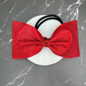 Solid glitter tailess competition cheer bow. Bow made in your colors. Price listed is per bow. Tailess bow, tailess bow, pigtail bows