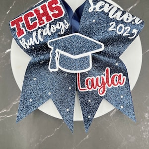 Senior Cheer Bows With OR Without cap pop-out and rhinestones... Made in your teams Colors. Price lIsted is per individual Cheer bow. Senior