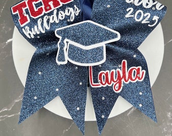 Senior Cheer Bows With OR Without cap pop-out and rhinestones... Made in your teams Colors. Price lIsted is per individual Cheer bow. Senior